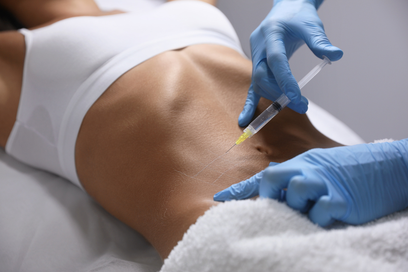 Young Woman Getting Belly Injection in Salon, Closeup