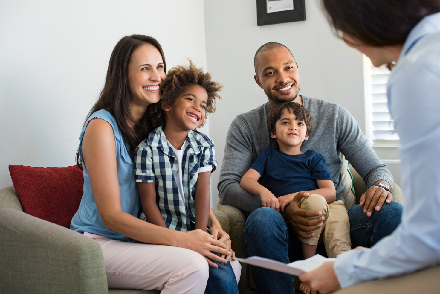 Happy Family Talking with Counselor Consulting on a Clinic